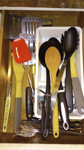 Red spoon/spatchula in a drawer separated by that criteria.